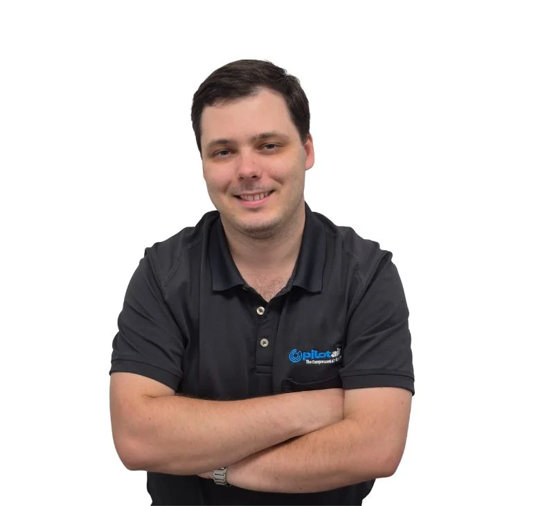 Pilot Air - Tim Wyllie Man wearing uniform smiling at the camera